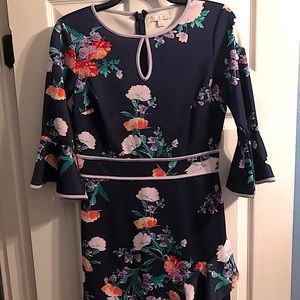 Navy blue floral ,lilac trim,bell sleeves w/ruffled asymmetrical bottom